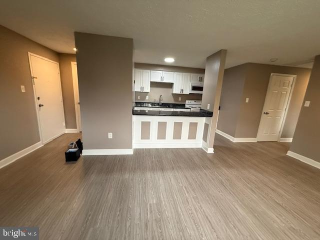 19513 Gunners Branch Road, Unit 514 Germantown, MD 20876 - Photo 10 of 42 a view of kitchen with stainless steel appliances wooden floor and windows