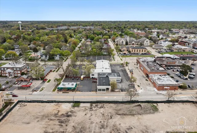 an aerial view of residential building with parking