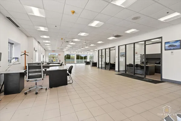 a lobby with furniture and a table
