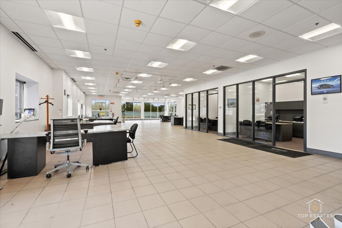 206 North Cook Street Barrington, IL 60010 - Photo 25 of 55 a large kitchen with kitchen island a counter top space a sink stainless steel appliances and cabinets