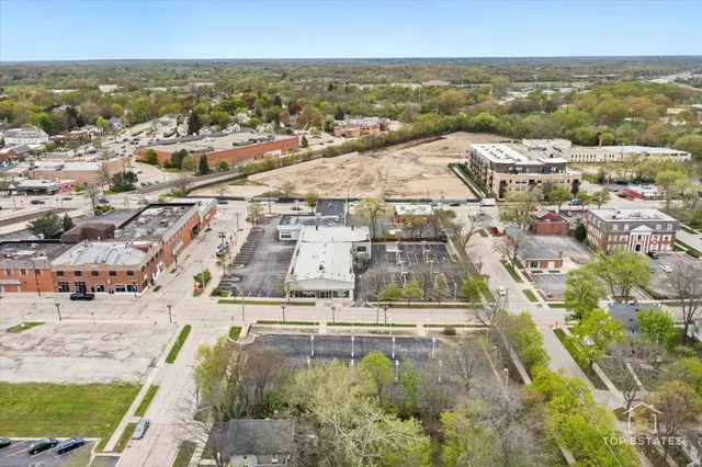 an aerial view of residential houses with outdoor space