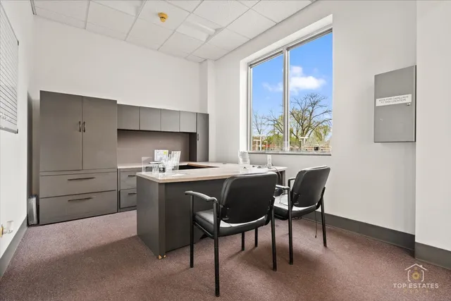 a kitchen with stainless steel appliances kitchen island granite countertop a sink a counter top space and cabinets