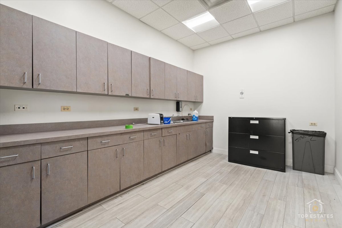 206 North Cook Street Barrington, IL 60010 - Photo 42 of 55 a kitchen with a sink and cabinets