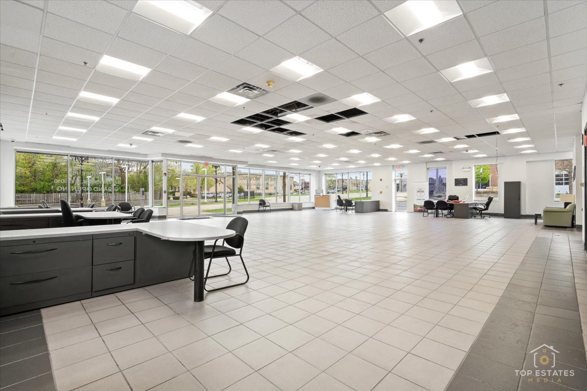 206 North Cook Street Barrington, IL 60010 - Photo 43 of 55 a kitchen with stainless steel appliances kitchen island granite countertop a sink a counter top space and cabinets