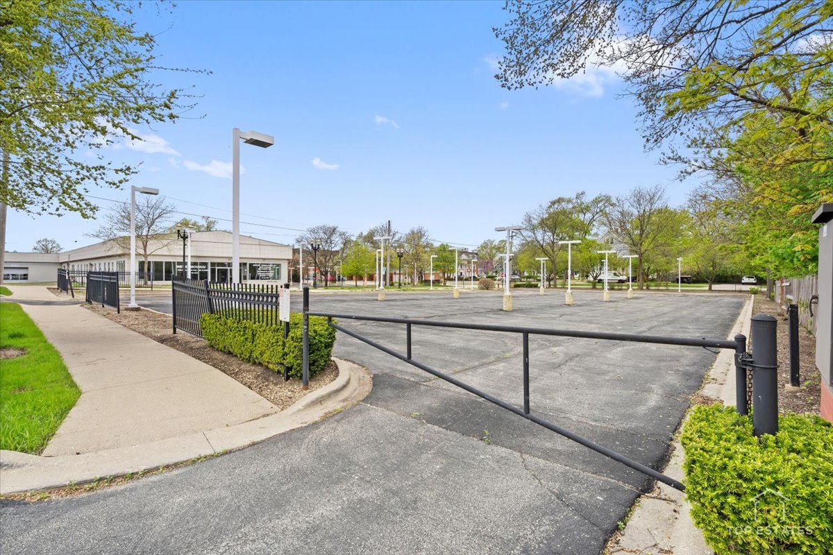 206 North Cook Street Barrington, IL 60010 - Photo 46 of 55 a view of a street with a bench and trees