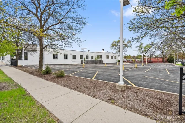 a view of multiple houses with a street