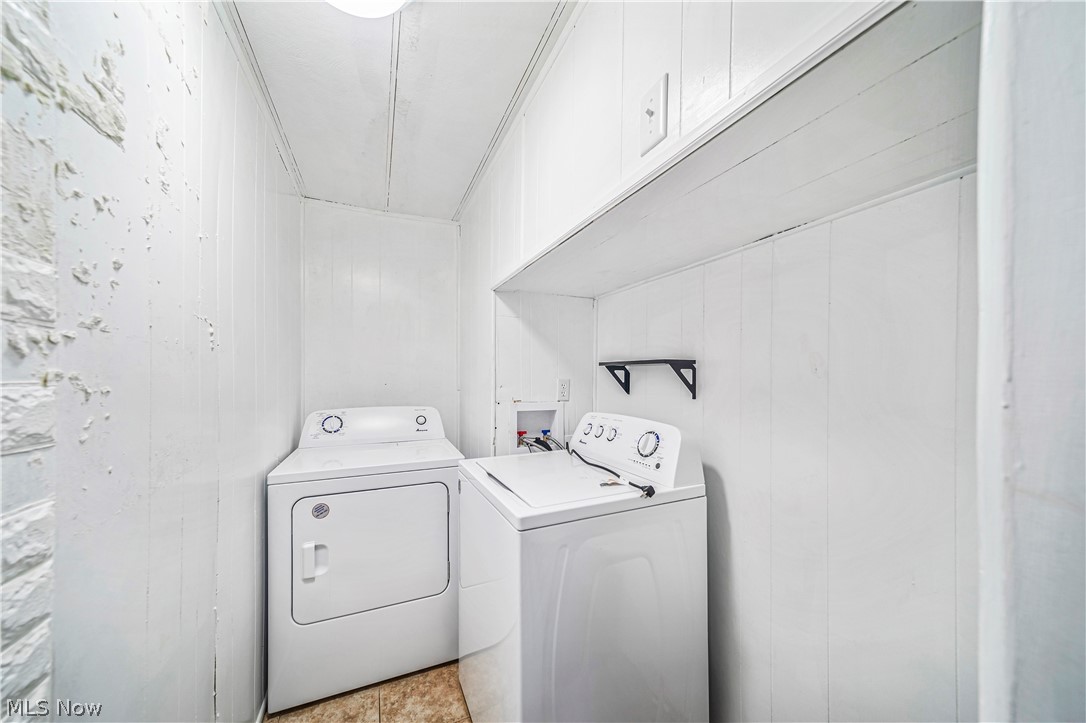 3501 Pymatuning Lake Road Andover, OH 44003 - Photo 33 of 36 Clothes washing area with cabinets, hookup for a washing machine, light tile floors, and washing machine and clothes dryer
