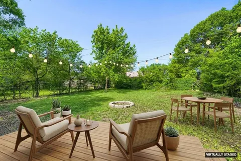 a view of a chairs and table in the patio