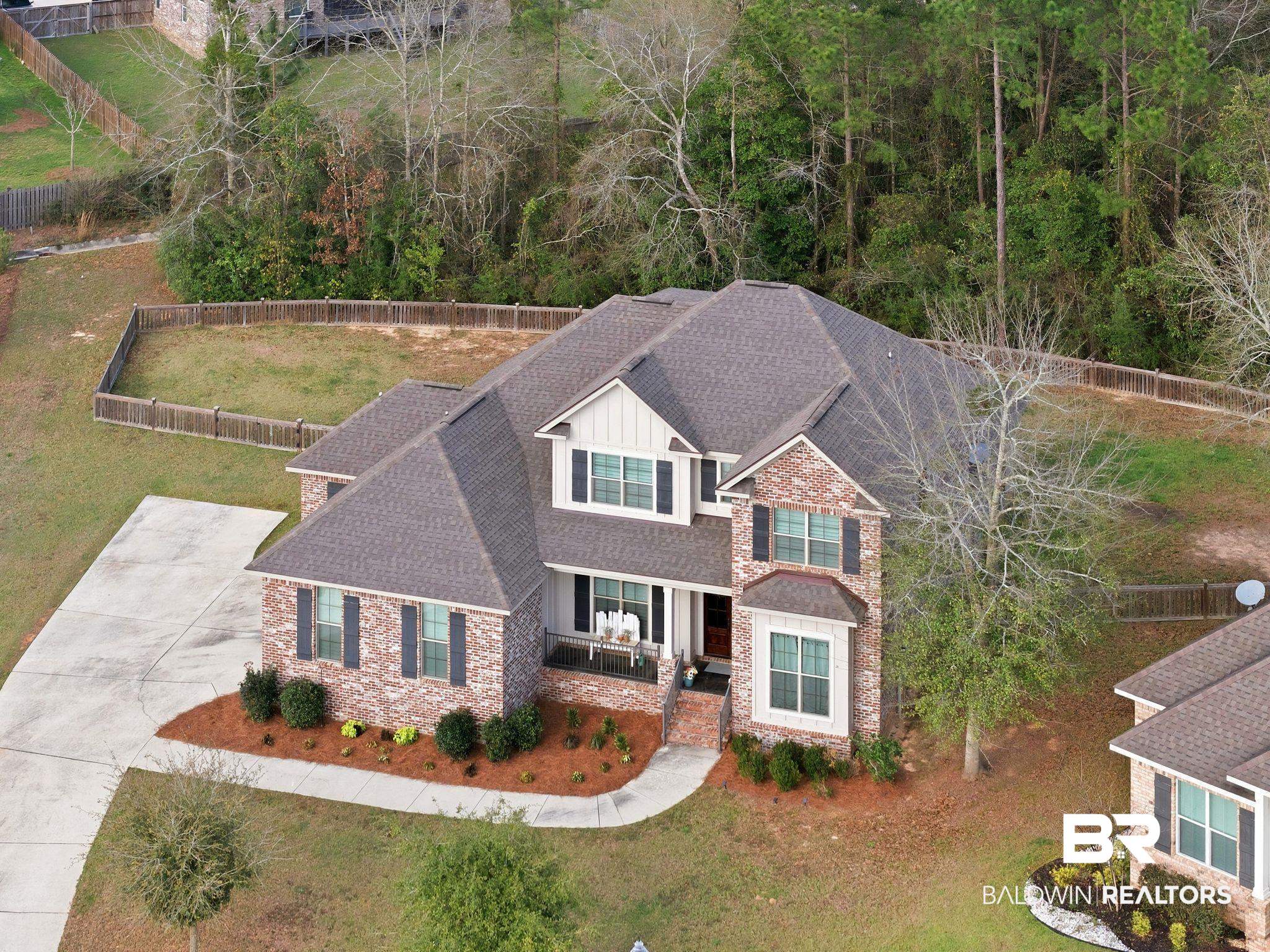 32194 Badger Court Daphne, AL 36527 - Photo 3 of 49 View of front of property with roof with shingles, board and batten siding, and a porch