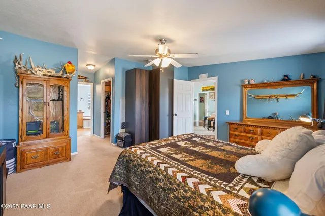 a view of walk in closet with clothes