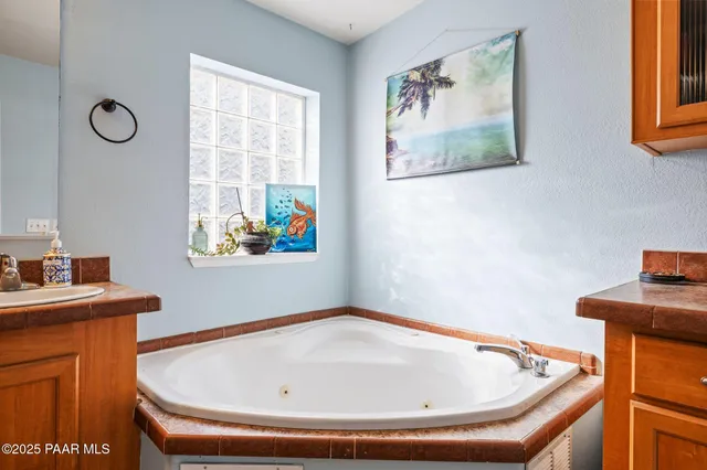 a bathroom with a glass shower door