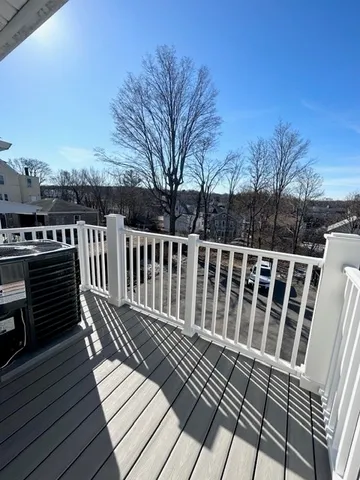 a view of a wooden roof with wooden floor and fence