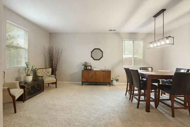 a kitchen with a sink a refrigerator a washer and dryer