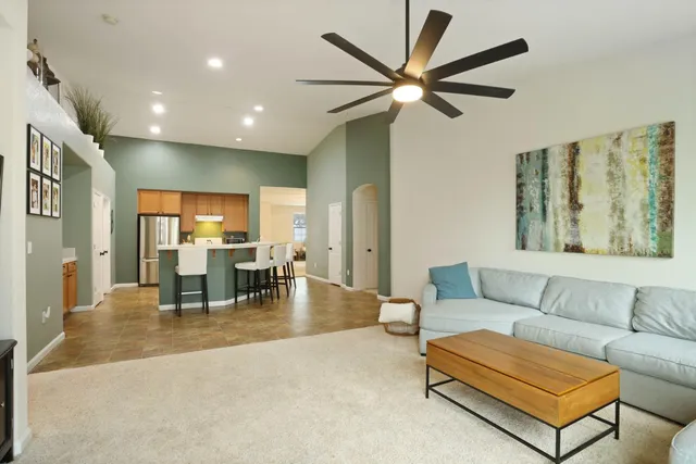 a living room with furniture and a large window