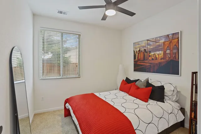 a bedroom with a bed and dresser