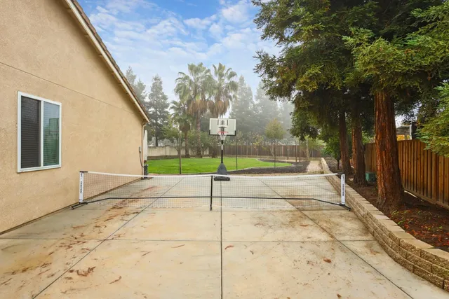 a view of a garden with a house