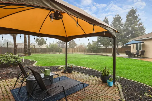 a view of outdoor space with garden and trees