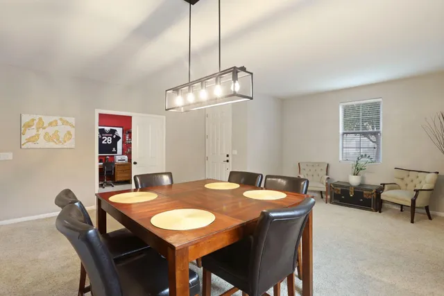 a view of a dining room with furniture window and outside view