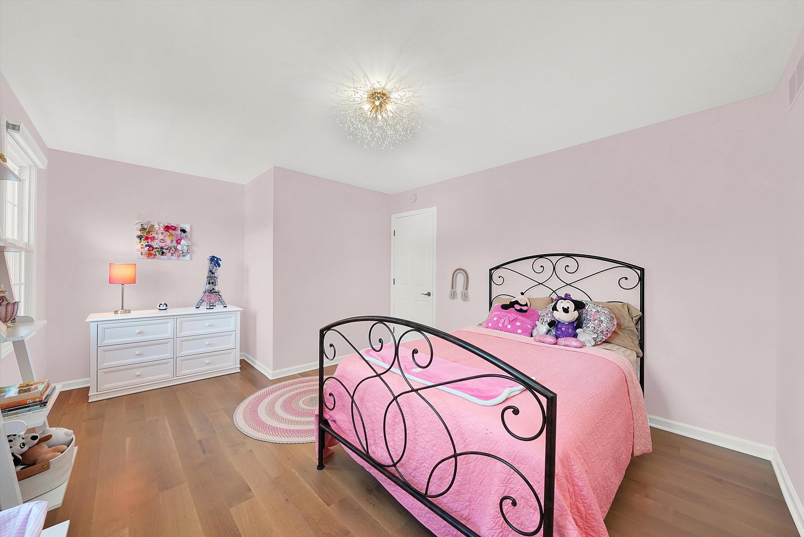 129 Sunset Ridge Road Willowbrook, IL 60527 - Photo 32 of 45 a bedroom with a bed and a chandelier