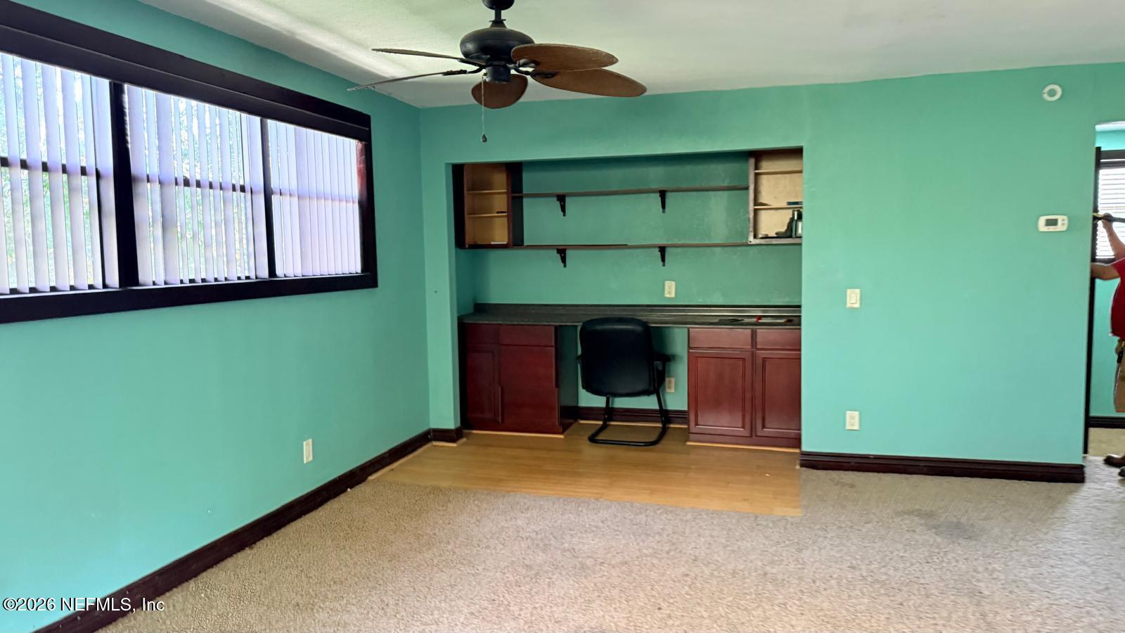 1645 Forest Hills Road Jacksonville, FL 32208 - Photo 10 of 15 a living room with furniture and a fireplace
