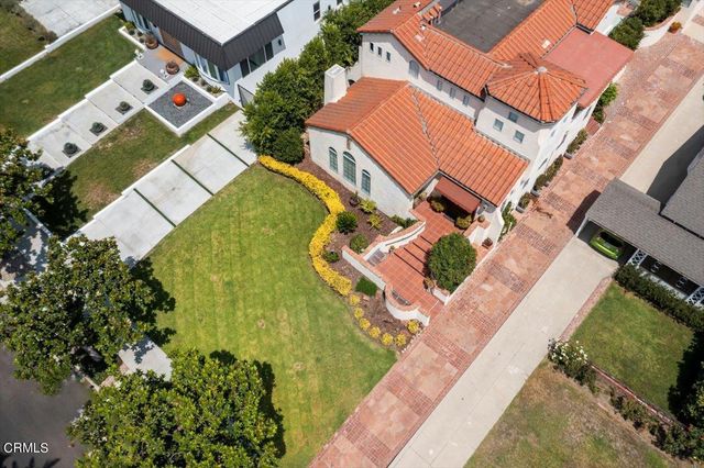 an aerial view of a house with a garden
