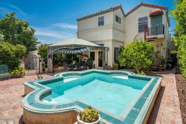 a view of a swimming pool with back yard