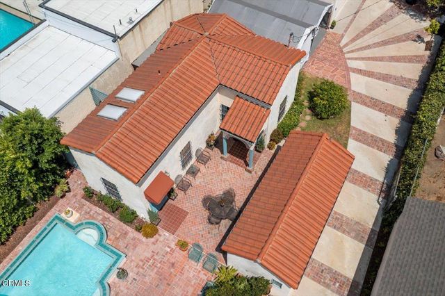 a kitchen with stainless steel appliances granite countertop a stove and a refrigerator