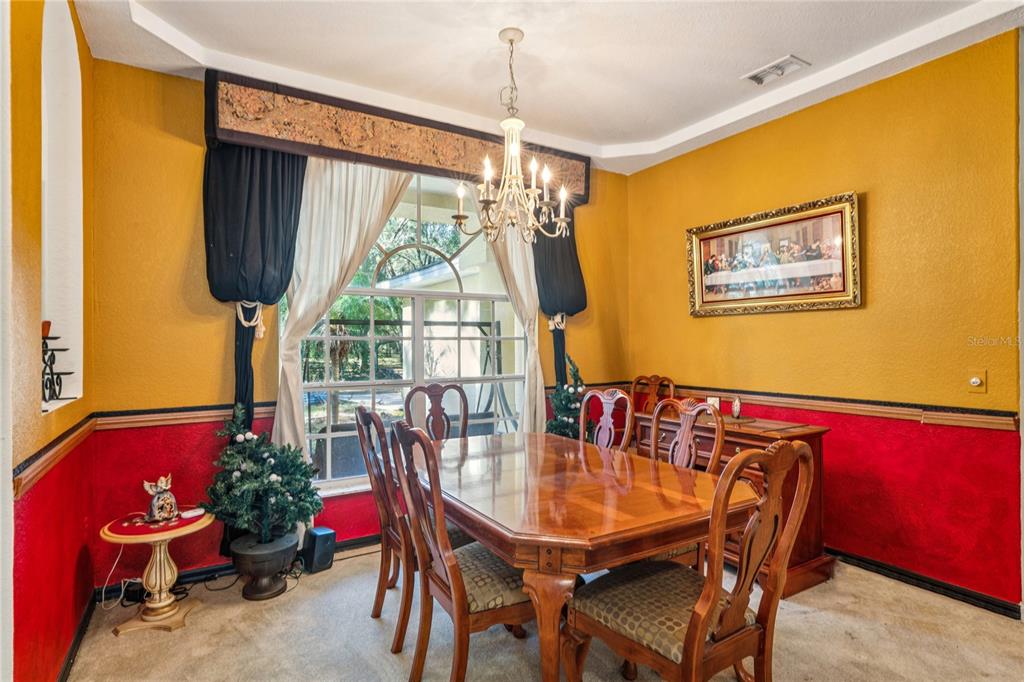 26861 Mondon Hill Road Brooksville, FL 34602 - Photo 12 of 51 a view of a dining room with furniture and a window