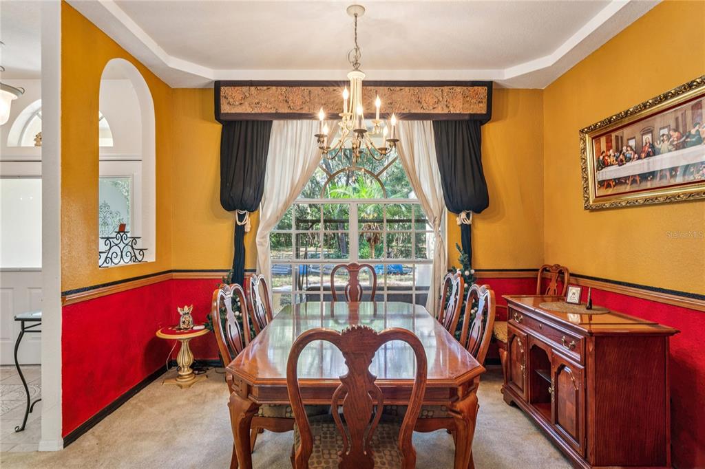 26861 Mondon Hill Road Brooksville, FL 34602 - Photo 13 of 51 a view of a dining room with furniture and a window