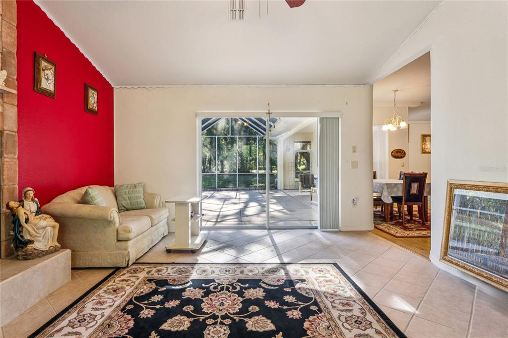 26861 Mondon Hill Road Brooksville, FL 34602 - Photo 16 of 51 a living room with furniture and a rug