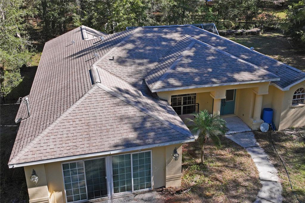 26861 Mondon Hill Road Brooksville, FL 34602 - Photo 50 of 51 a view of a house with a yard
