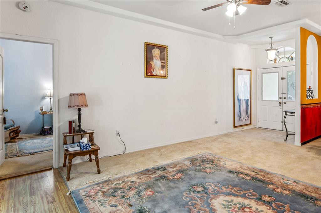 26861 Mondon Hill Road Brooksville, FL 34602 - Photo 6 of 51 a view of a livingroom with wooden floor and a cabinet