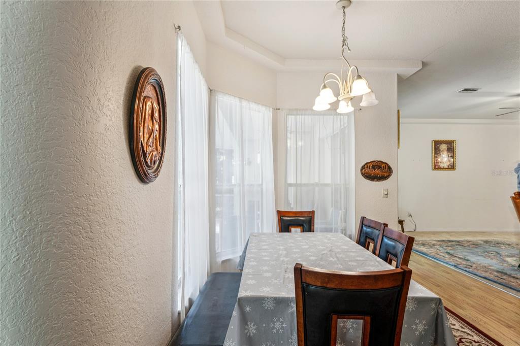 26861 Mondon Hill Road Brooksville, FL 34602 - Photo 10 of 51 a bathroom with a granite countertop sink a mirror and shower curtain