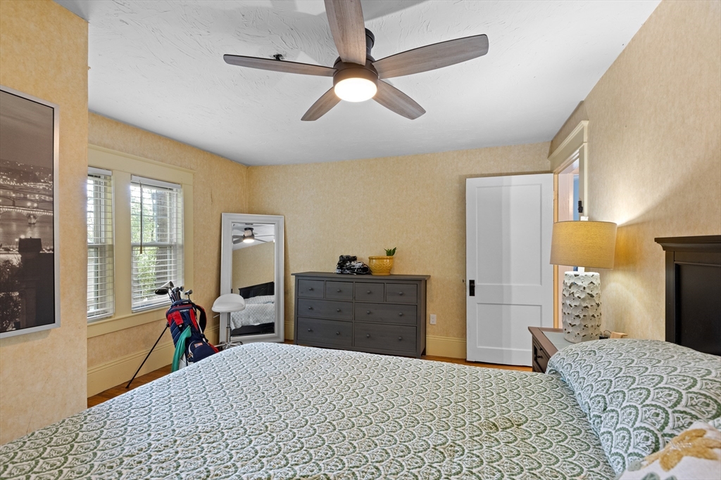 20 St Elmo Road Worcester, MA 01602 - Photo 25 of 40 a bedroom with a bed and wooden floor