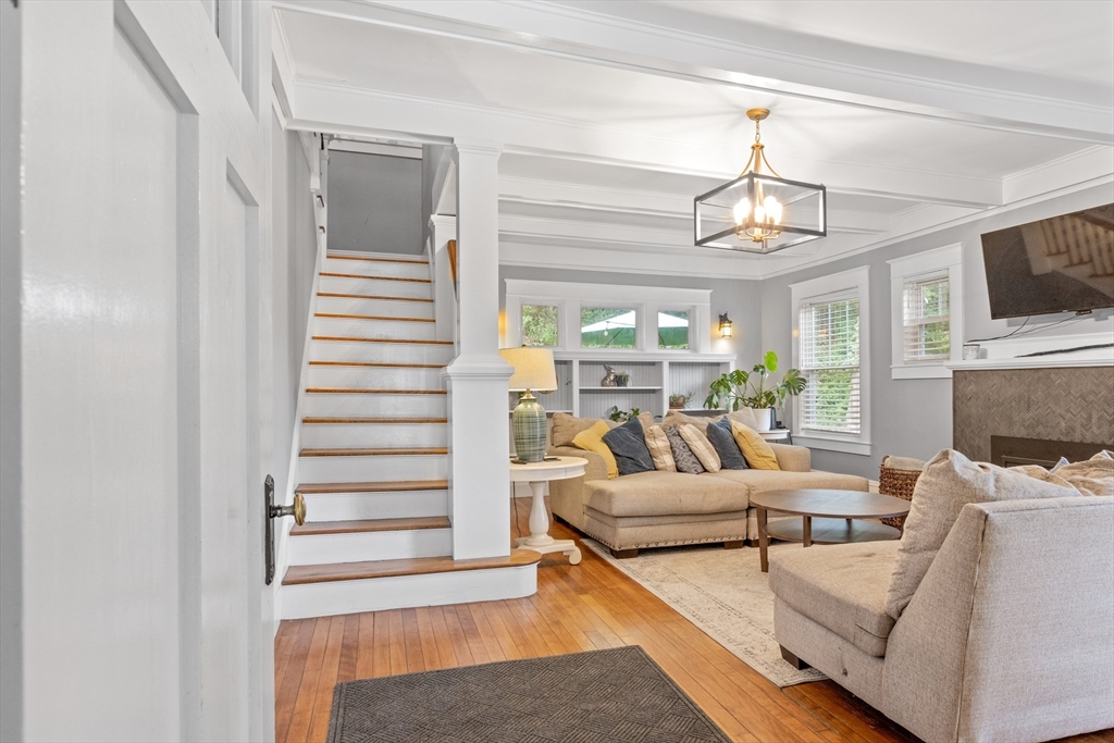 20 St Elmo Road Worcester, MA 01602 - Photo 5 of 40 a living room with furniture a flat screen tv and kitchen view