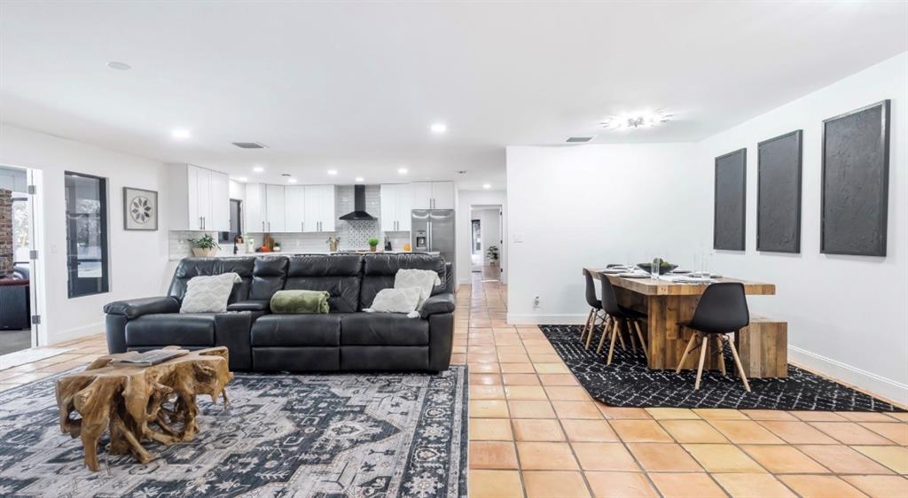 17191 38th Road North Loxahatchee, FL 33470 - Photo 14 of 60 a living room with furniture and a dining table with kitchen view