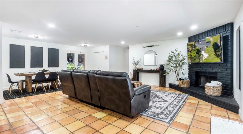 17191 38th Road North Loxahatchee, FL 33470 - Photo 16 of 60 a living room with furniture a fireplace and a flat screen tv