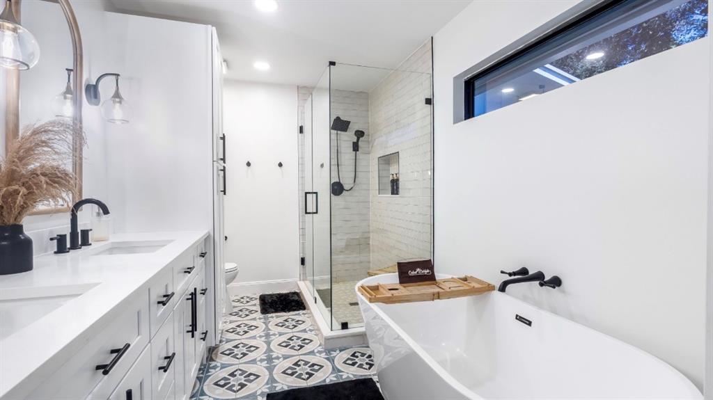 17191 38th Road North Loxahatchee, FL 33470 - Photo 26 of 60 a bathroom with a bathtub sink and mirror