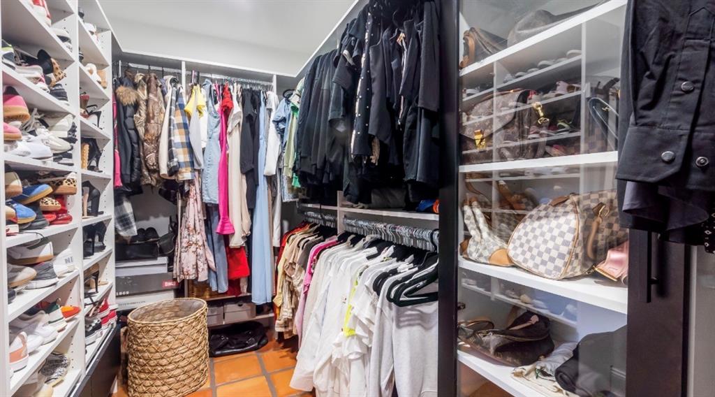 17191 38th Road North Loxahatchee, FL 33470 - Photo 28 of 60 a view of walk in closet with clothes