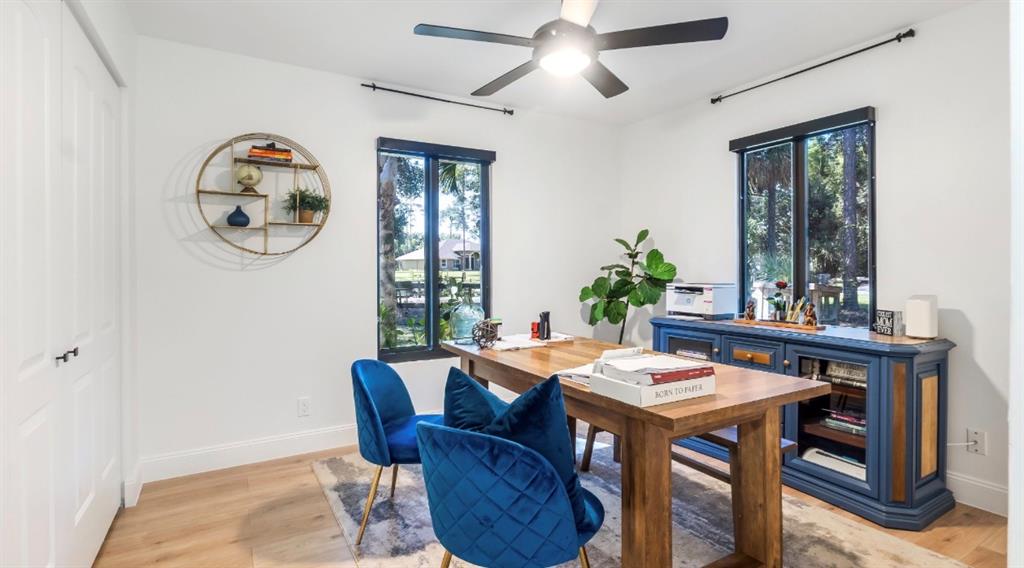17191 38th Road North Loxahatchee, FL 33470 - Photo 34 of 60 a view of a dining room with furniture window and wooden floor