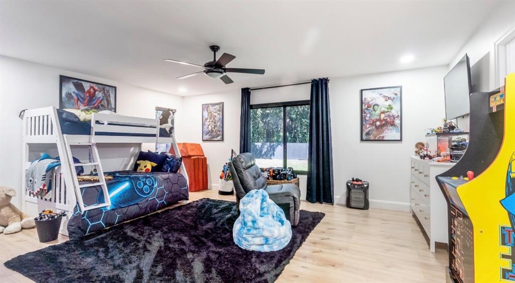 17191 38th Road North Loxahatchee, FL 33470 - Photo 36 of 60 a bed room with furniture and a flat screen tv