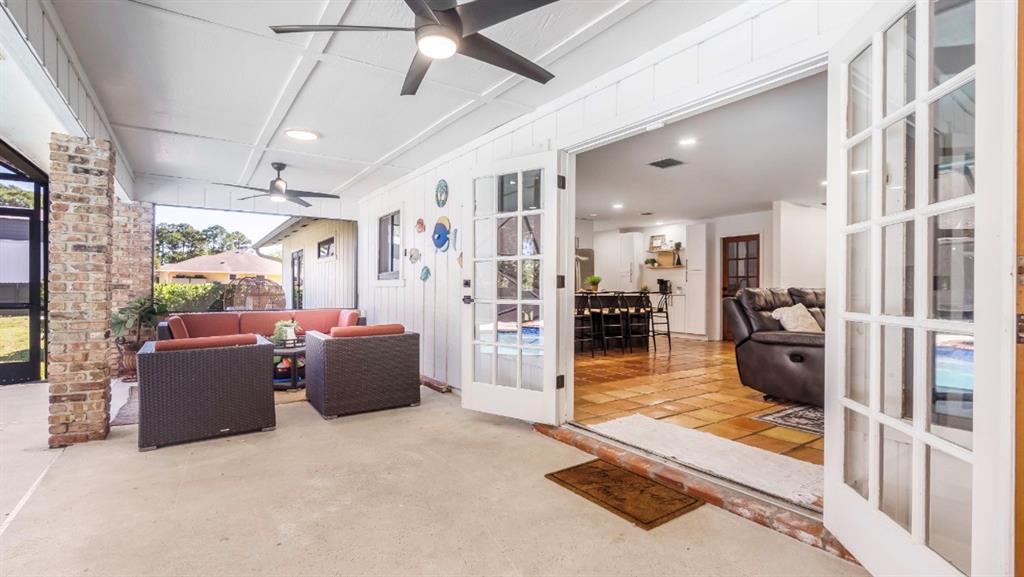 17191 38th Road North Loxahatchee, FL 33470 - Photo 40 of 60 a living room with furniture and a flat screen tv