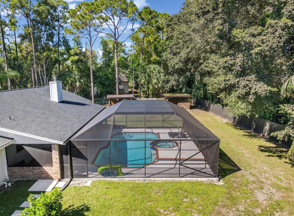 17191 38th Road North Loxahatchee, FL 33470 - Photo 50 of 60 a view of a swimming pool with a patio