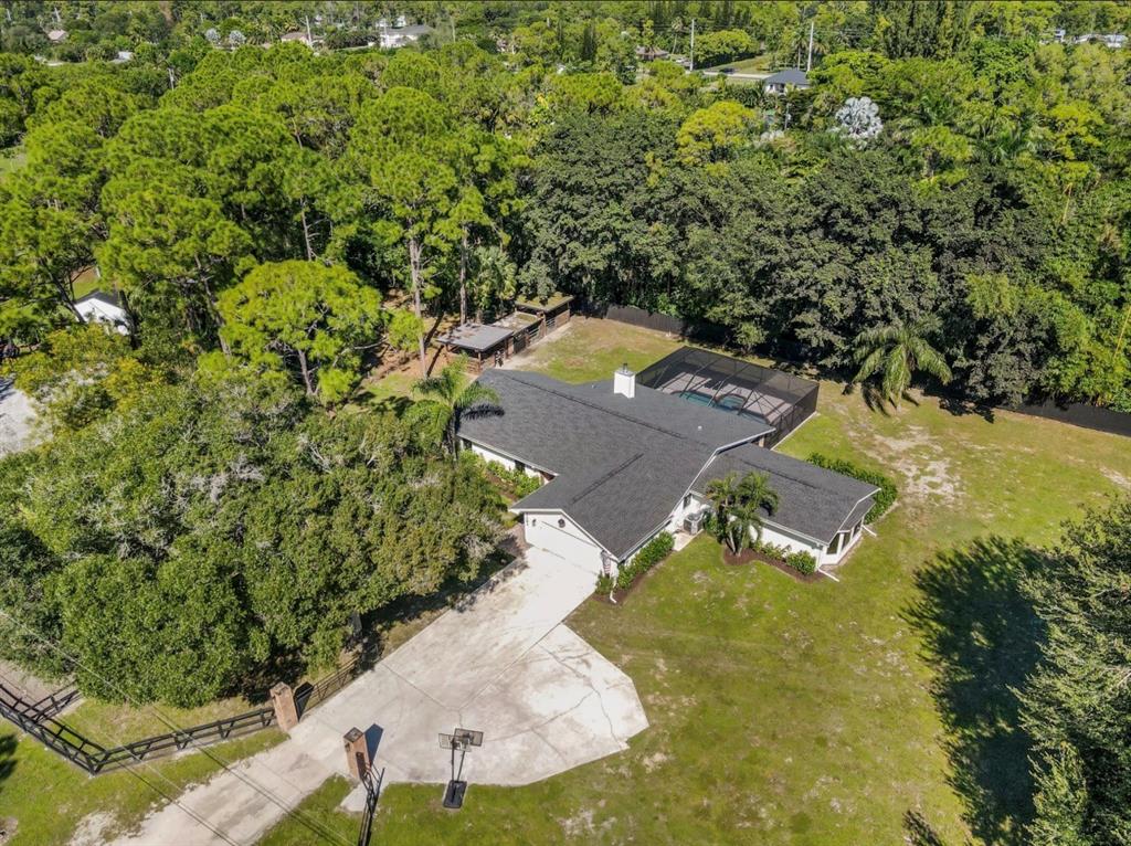 17191 38th Road North Loxahatchee, FL 33470 - Photo 54 of 60 an aerial view of residential houses with outdoor space