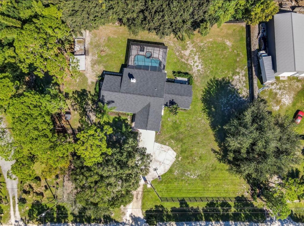 17191 38th Road North Loxahatchee, FL 33470 - Photo 56 of 60 an aerial view of a house with a yard swimming pool and outdoor seating