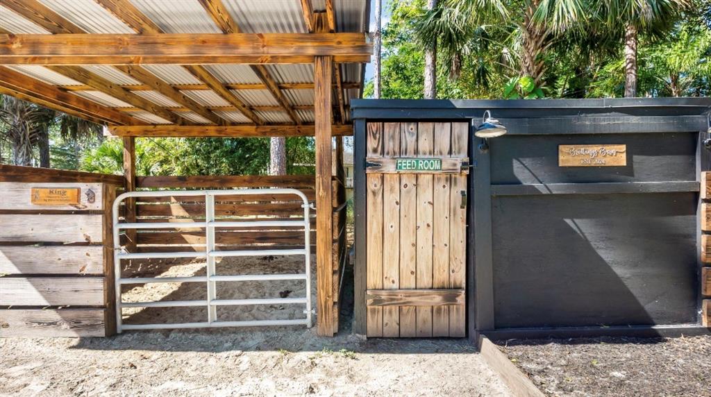 17191 38th Road North Loxahatchee, FL 33470 - Photo 58 of 60 a front view of a house with a bench