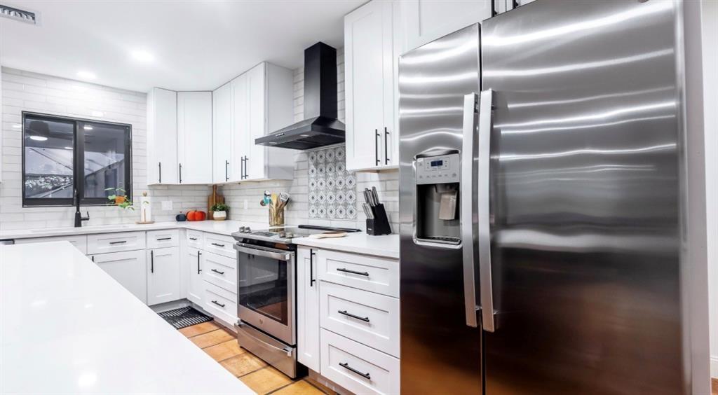 17191 38th Road North Loxahatchee, FL 33470 - Photo 6 of 60 a kitchen with a refrigerator and a sink
