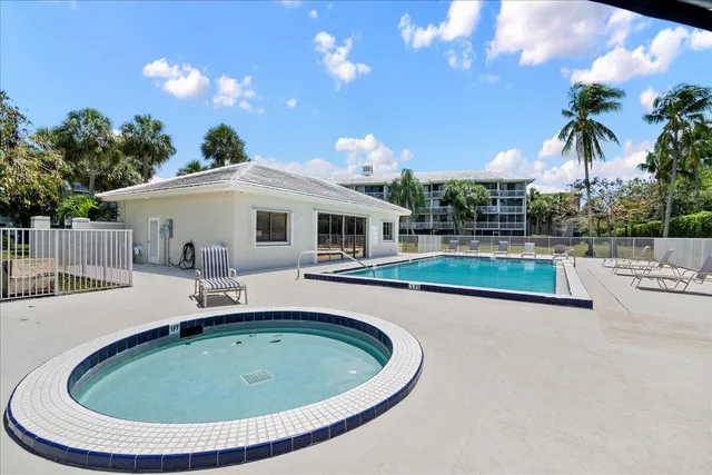 a view of a swimming pool with a lounge chairs