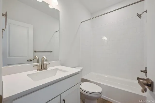 a bathroom with a sink a toilet and a bathtub