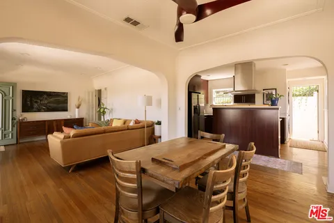 a view of a dining room with furniture and window